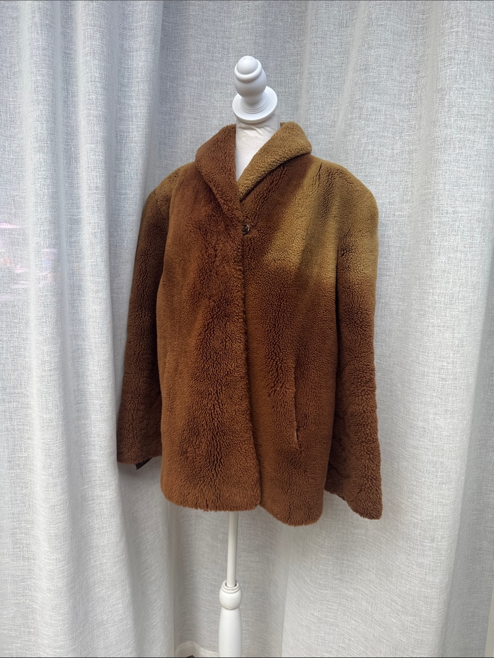 vintage mid-length shearling teddy coat in a warm camel or tobacco brown color